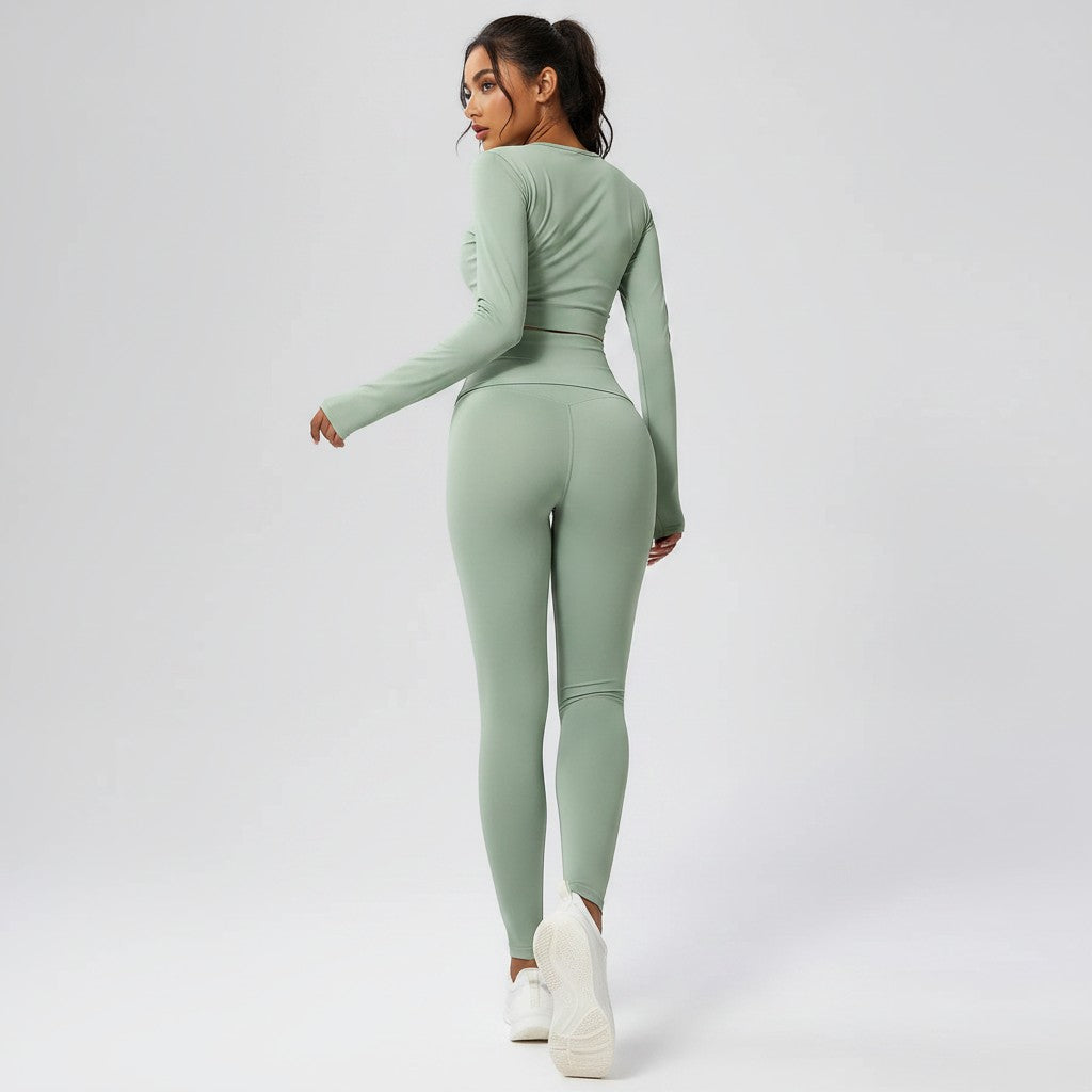 Model wearing VIVU sage green seamless high-waist leggings and matching long-sleeve top from a rear view